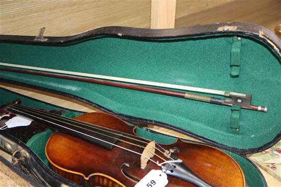 A German Strad style violin and a small violin and two bows